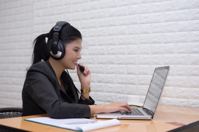 young businesswoman with headset sitting office table 1